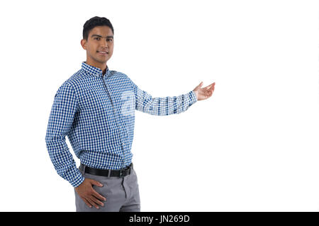 Portrait of man gesturing against white background Stock Photo