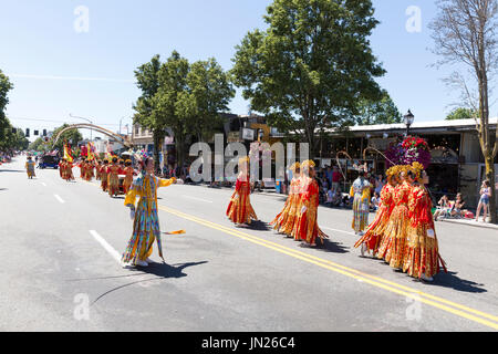 Seattle, Washington: Chinese Community Girls Drill Team performs at the West Seattle Grand Parade. The annual parade, hosted by the West Seattle Rotar Stock Photo