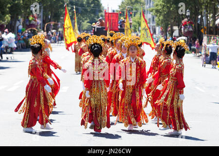 Seattle, Washington: Chinese Community Girls Drill Team performs at the West Seattle Grand Parade. The annual parade, hosted by the West Seattle Rotar Stock Photo