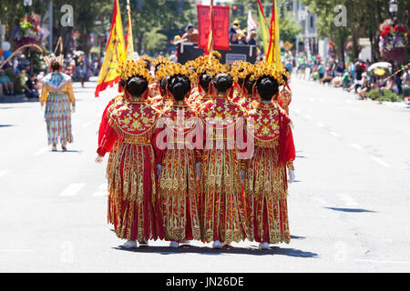 Seattle, Washington: Chinese Community Girls Drill Team performs at the West Seattle Grand Parade. The annual parade, hosted by the West Seattle Rotar Stock Photo