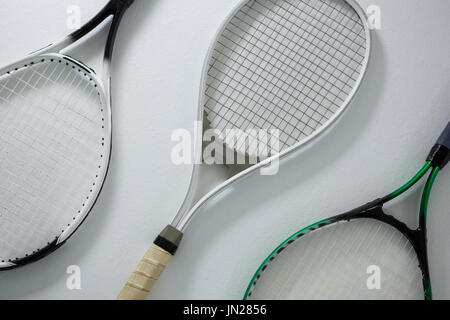 High angle view of metallic tennis rackets on white background Stock Photo