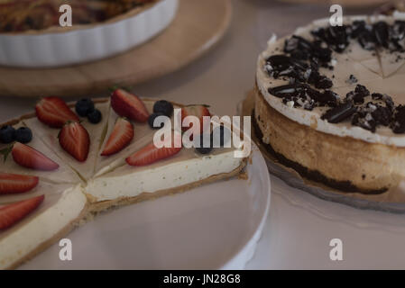 Close up of tart and cake on table in cafe Stock Photo