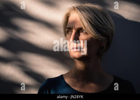 Thoughtful senior woman looking away Stock Photo