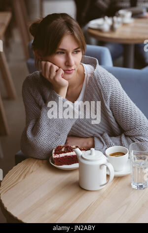 Beautiful woman sitting in the cafe Stock Photo