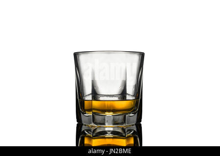 Whiskey filled glass, with clear reflection below, white background Stock Photo