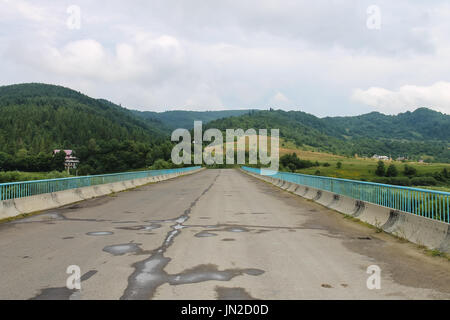 Road between Carpathian hills after light rain. Ukraine Stock Photo