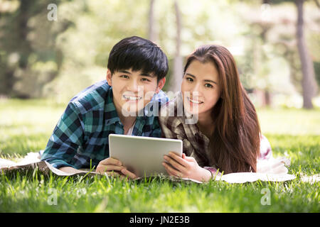 Young couple using digital tablet. Stock Photo