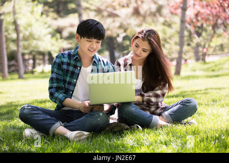 Young couple using laptop Stock Photo