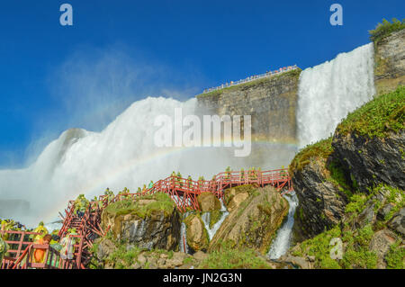 'Heaven on Earth.' Rainbow intensifying the beauty of American Falls at Hurricane Deck - Cave of the Winds, Niagara Falls, NY. Stock Photo