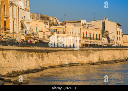 Ortigia Sicily harbour, view of the Passeggio Adorno running the length of the western sea wall in Ortigia, Syracuse, Sicily, Stock Photo