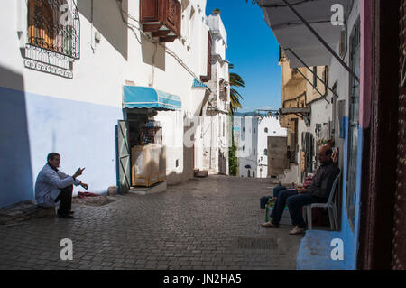 People in the narrow alleys of Tangier, city on the Maghreb coast with its unique blend of cultures, for centuries the Europe's gateway to Africa Stock Photo