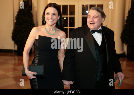 Actress Julia Louis-Dreyfus, left, and William Louis-Dreyfus arrive to a state dinner hosted by U.S. President Barack Obama and first lady Michelle Obama in honor of French President Francois Hollande at the White House in Washington, D.C., U.S., on Tuesday, Feb. 11, 2014. Obama and Hollande said the U.S. and France are embarking on a new, elevated level of cooperation as they confront global security threats in Syria and Iran, deal with climate change and expand economic cooperation.  Credit: Andrew Harrer / Pool via CNP