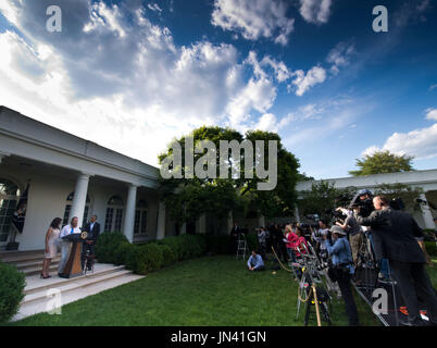 United States President Barack Obama (right) listens as Bob Bergdahl (center) makes a statement and Jani Bergdahl (left) looks on regarding the release of their son U.S. Army Sergeant Bowe Bergdahl by the Taliban, Saturday May 31, 2014, in the Rose Garden at the White House in Washington, D.C. Credit: John Harrington / Pool via CNP