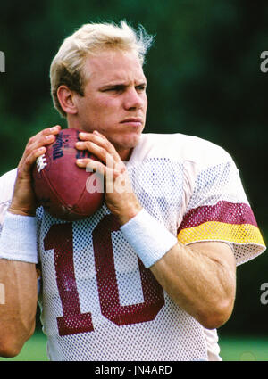 The ball pops free as Washington Redskins quarterback Jay Schroeder is hit  by Giants Leonard Marshall while trying to pass during the third quarter of NFC  Championship game in East Rutherford, N.J.