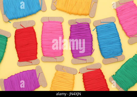 colorful thread spools - needlework, craft, sewing and tailoring concept Stock Photo