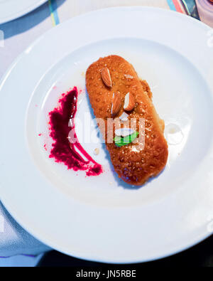 Arabic dessert on the white plate in a restaurant Stock Photo