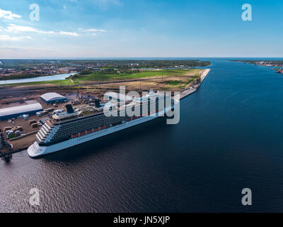 Big white passenger ship moored at the cargo port Stock Photo
