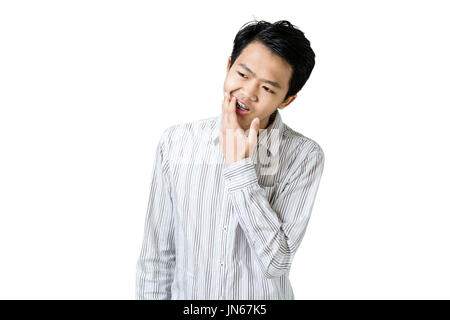 Portrait of a young business man with teeth brace dental having a toothache. Isolated on white background with copy space and clipping path Stock Photo