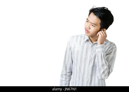 Portrait of a young business man having an earache. Isolated on white background with copy space and clipping path Stock Photo