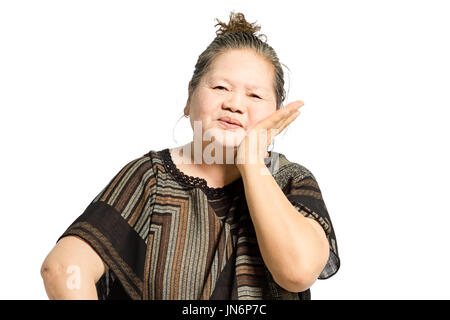 portrait of a mature woman having a toothache. Isolated on white background with clipping path Stock Photo