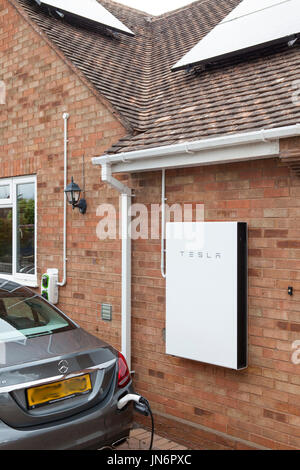 A Mercedes C class Hybrid electric car being charged ( via a Rolec charger) from solar PV stored in a Tesla Powerwall 2, a 14kWh battery.  All done fr Stock Photo