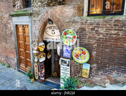 Siena, Italy - October 19, 2016: Street souvenir shop at the Old town of Siena, Tuscany, Italy Stock Photo