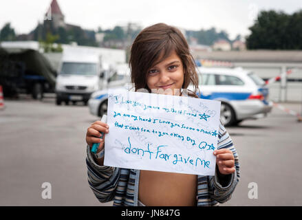 Passau, Germany - August 2th, 2015: young refugee girl from Afghanistan named Nasila in a refugee camp in Passau seeking asylum in Europe. Stock Photo