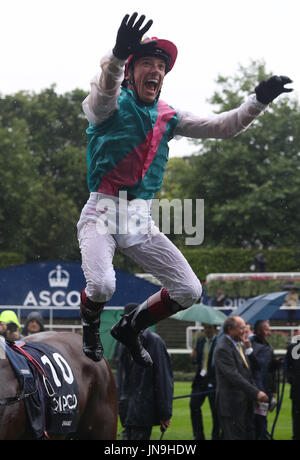 Frankie Dettori jumps from Enable after winning The King George VI & Queen Elizabeth Stakes run during day two of King George VI Weekend at Ascot Racecourse, Berkshire. Stock Photo