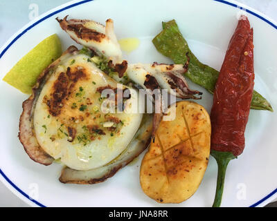 Sepia a la plancha, Grilled cuttlefish, a typical Spanish dish served in a tapas bar. Stock Photo