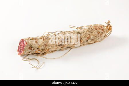 Dry cured pork sausage on white background Stock Photo