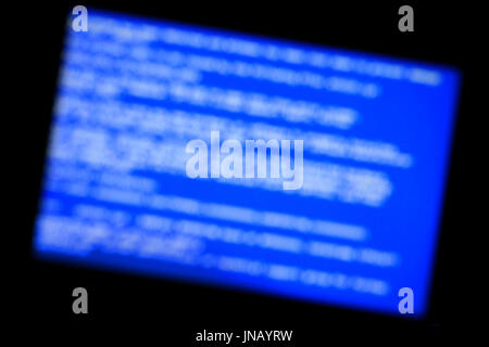 Blue screen of system crash. Defocused background Stock Photo