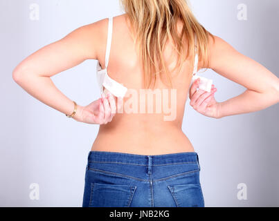 Sexy woman unhooking her bra, Stock Photo, Picture And Low Budget