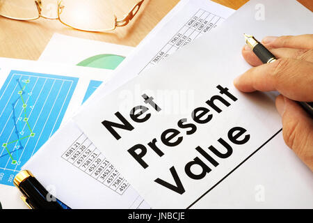 Net present value NPV documents on a table. Stock Photo