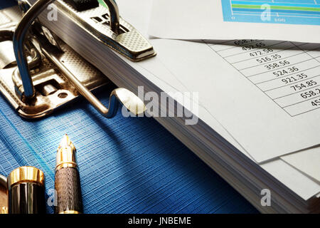 Stack of financial documents on an office desk. Stock Photo
