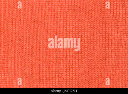 Stretch Viscose Fabric. Coral color texture backdrop high resolution Stock Photo