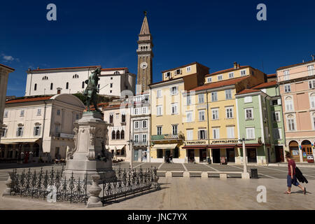 Tartini Statue in Tartini Square Piran Slovenia with St. George's Parish Roman Catholic Church and clock and bell tower Stock Photo