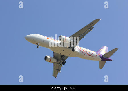 CHIANGMAI , THAILAND- FEBRUARY 5 2014 : HS-TXB Airbus A320-200 with winglet of Thaismile airway. Landing to Chiangmai airport from Bangkok Suvarnabhum Stock Photo