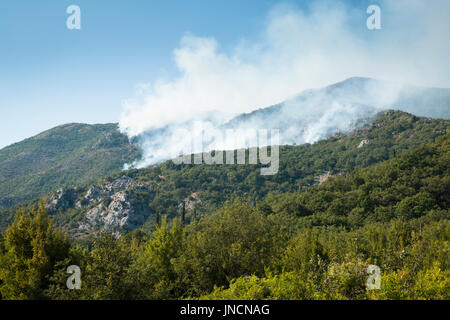 Huge forest fires on the mountains close to Herceg Novi and the bay of Kotor in Montenegro Stock Photo