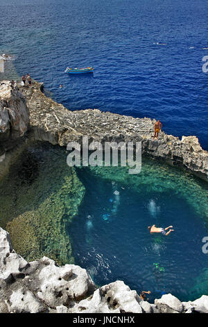 Scuba divers at the Azure Window in Dwejra, Gozo Stock Photo