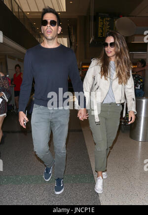 Eli Roth and his wife Lorenza Izzo arrive at Los Angeles International ...