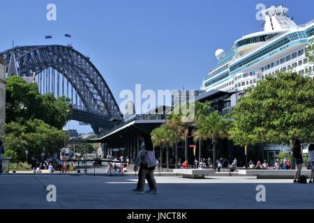 View of Sydney Harbor Bridge and unidentifiable cruise ship and unidentifiable people at Sydney Harbour, Australia on 11 Dec 2016 Stock Photo