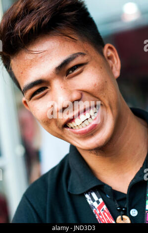 Portrait of young man smiling, Puerto Princesa, Palawan, Philippines Stock Photo