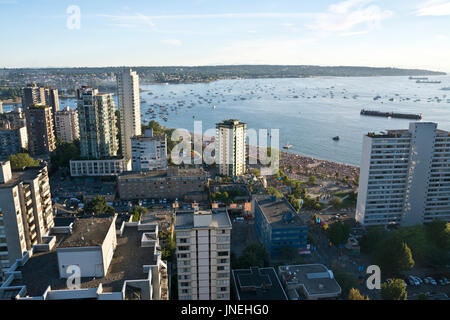Vancouver, BC, Canada.  29th July, 2017.   In the early evening, large crowds of people fill the beaches by English Bay in Vancouver to wait for the Honda Celebration of Light fireworks competition to begin.  The annual event takes place in a residential and shopping area in the West End of the city.  Maria Janicki/Alamy