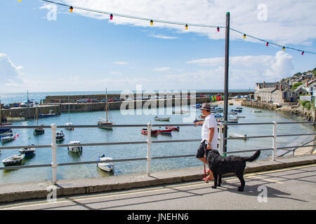 Mousehole, Cornwall, UK. 30th July 2017. UK Weather. It was a warm and sunny start to Sunday at Mousehole. However showers are forecast for later on. Credit: cwallpix/Alamy Live News Stock Photo