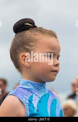 Swanage, Dorset, UK. 30th July, 2017. Visitors flock to Swanage to watch the procession parade, as part of Swanage Carnival week. The theme this year is Swanage Goes Global for participants to show the national dress or characteristics of their favourite country. Young girl takes part in the carnival procession. Credit: Carolyn Jenkins/Alamy Live News Stock Photo