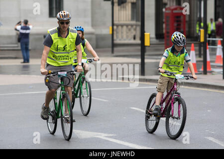 London, UK. 29th July, 2017. The Prudential ride in London a man and a boy on the ride Credit: Brian Southam/Alamy Live News Stock Photo