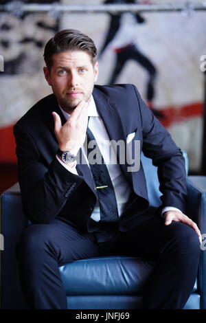 Young Man Dressed in a Suit Stock Photo