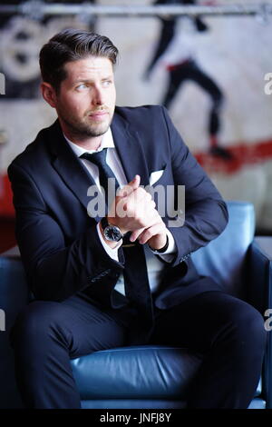 Young Man Dressed in a Suit Stock Photo