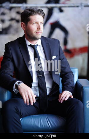 Young Man Dressed in a Suit Stock Photo