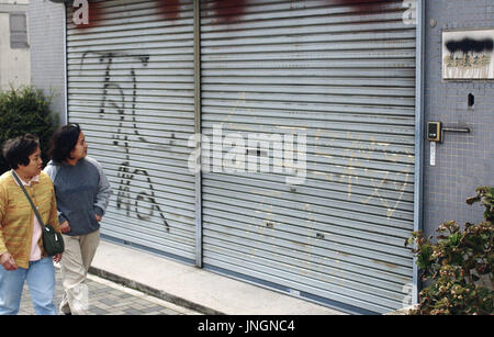 Delegates Of The General Association Of Korean Residents In Japan Clap In Front Of Large Portraits Of Former North Korean Leader Kim Il Sung L And Current Leader Kim Jong Il At The Opening